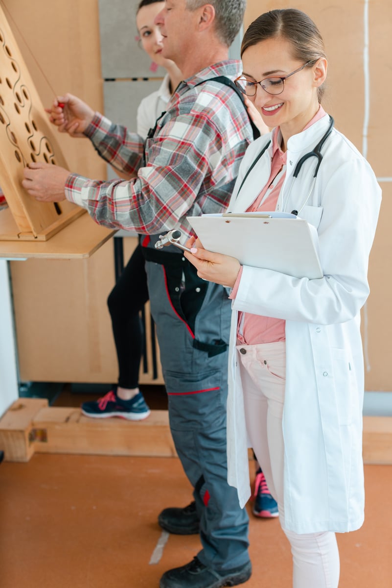 Doctor Writing down Results from Occupational  Dexterity Test